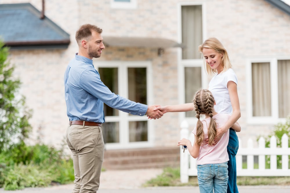 Co-parents shaking hands in agreement