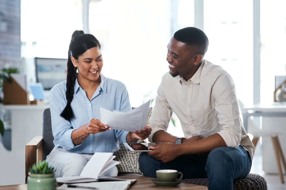 Lawyer and client going through paperwork together