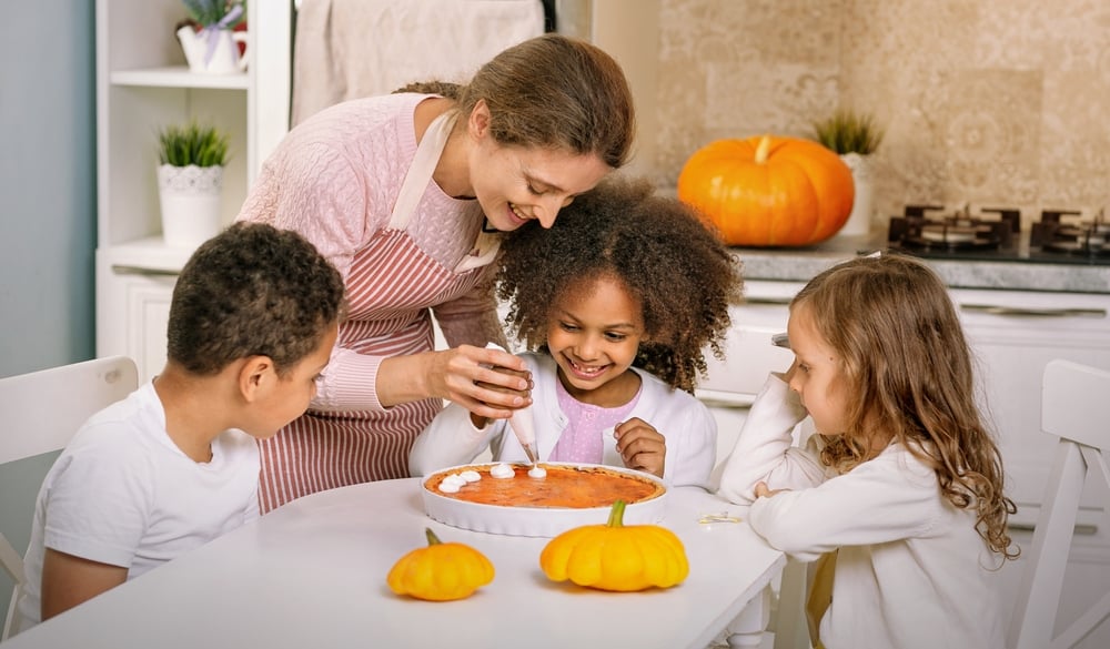 Family making pumpkin pie