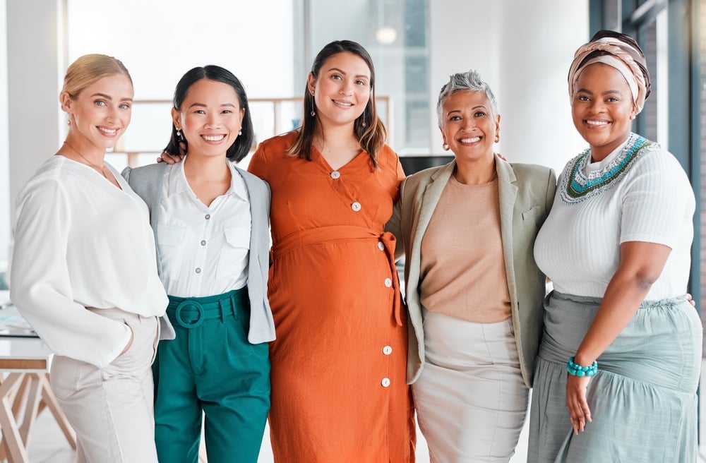 Professional women standing in a line showcasing diversity and inclusion in the office
