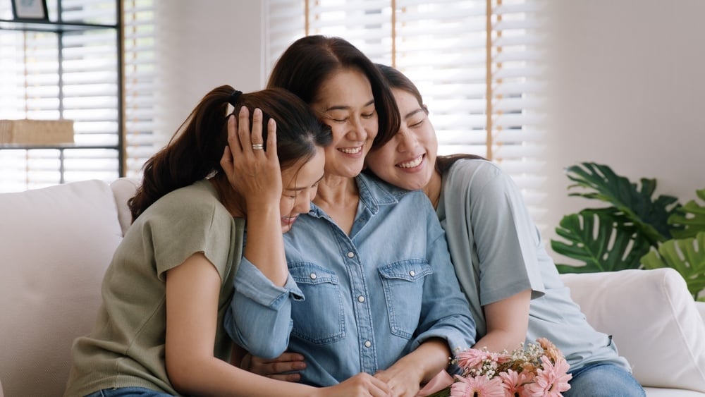 Asian mother enjoying quality time with teen daughters