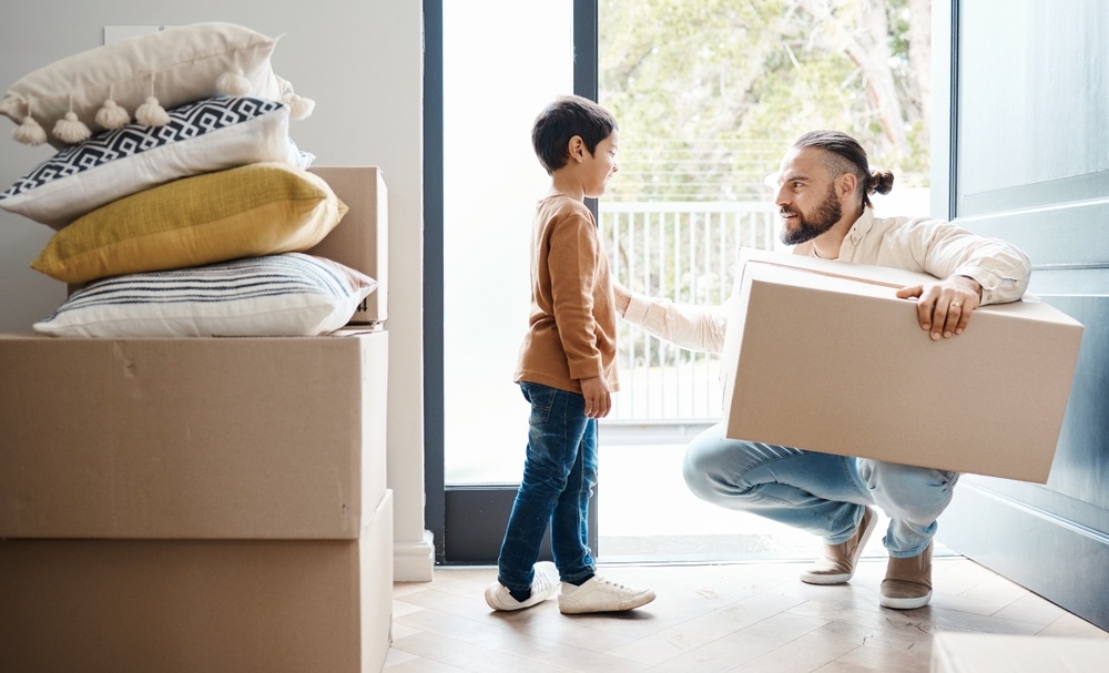 Father and son with moving boxes