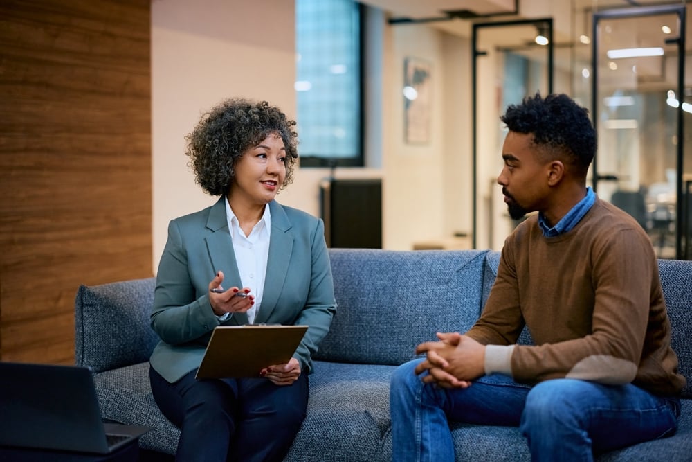 Female lawyer giving advice to male client