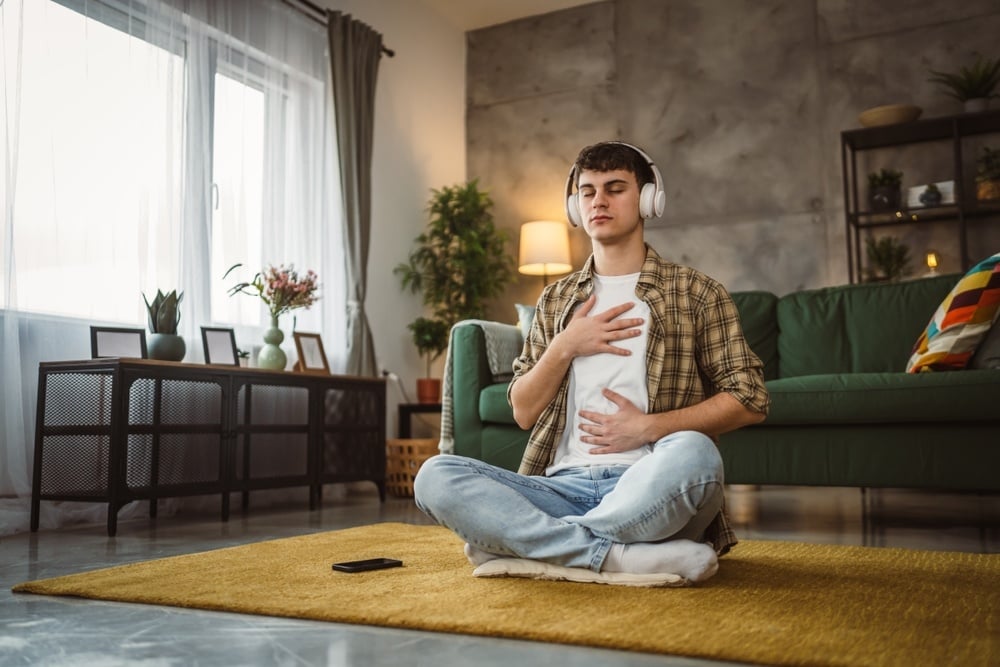 Male student practicing self care at home