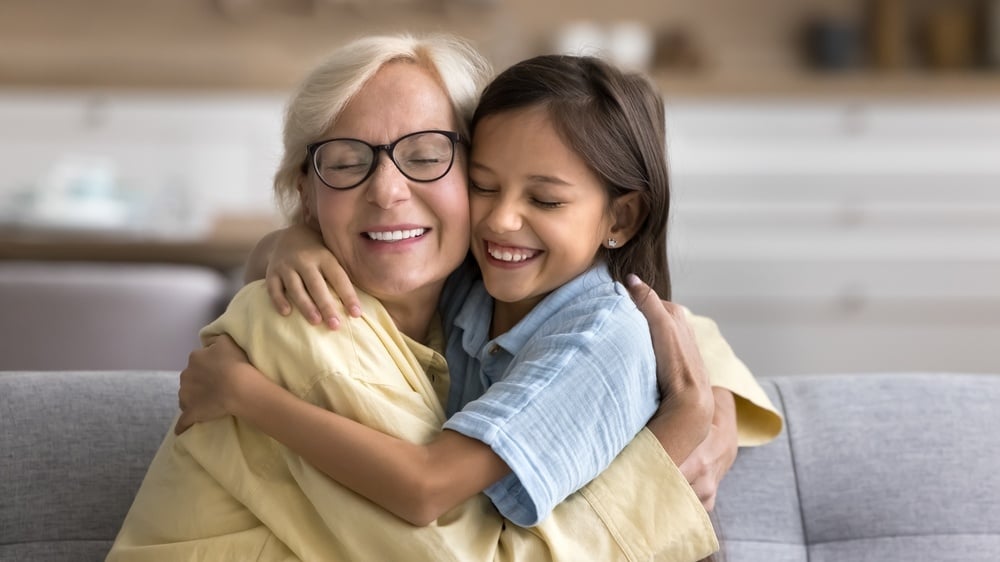 Grandma with granddaughter hugging